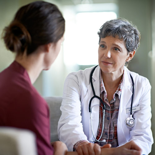 Photos of a doctor talking to a patient - M&N Insurance