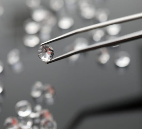 Jeweller examining a diamond - M&N Insurance