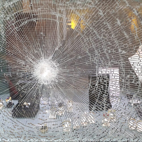 Photo of a smashed window - M&N Insurance